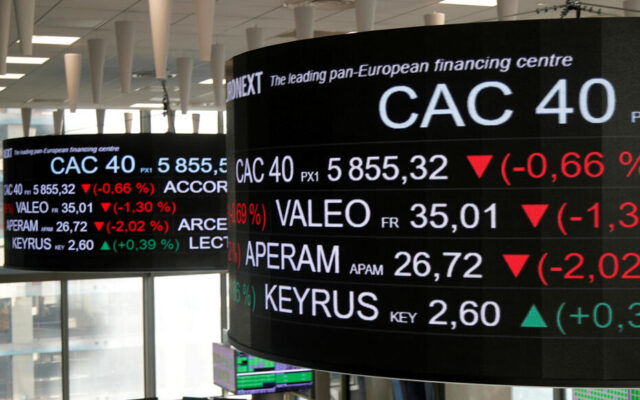 FILE PHOTO: Stock market operators work at the Euronext headquarters at La Defense business and financial district in Courbevoie near Paris